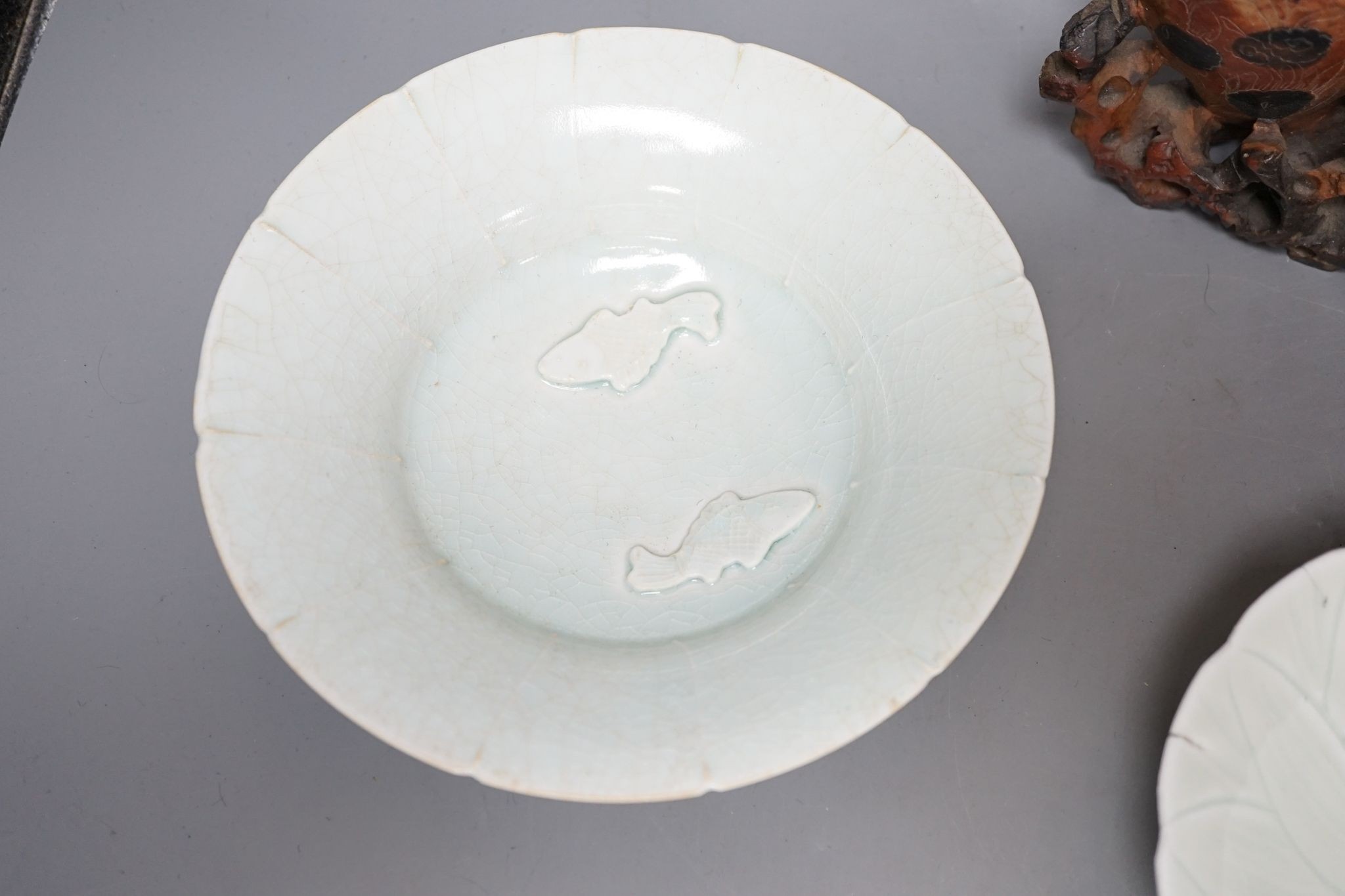 A Chinese soapstone carving, three Qingbai type bowls, 29cm